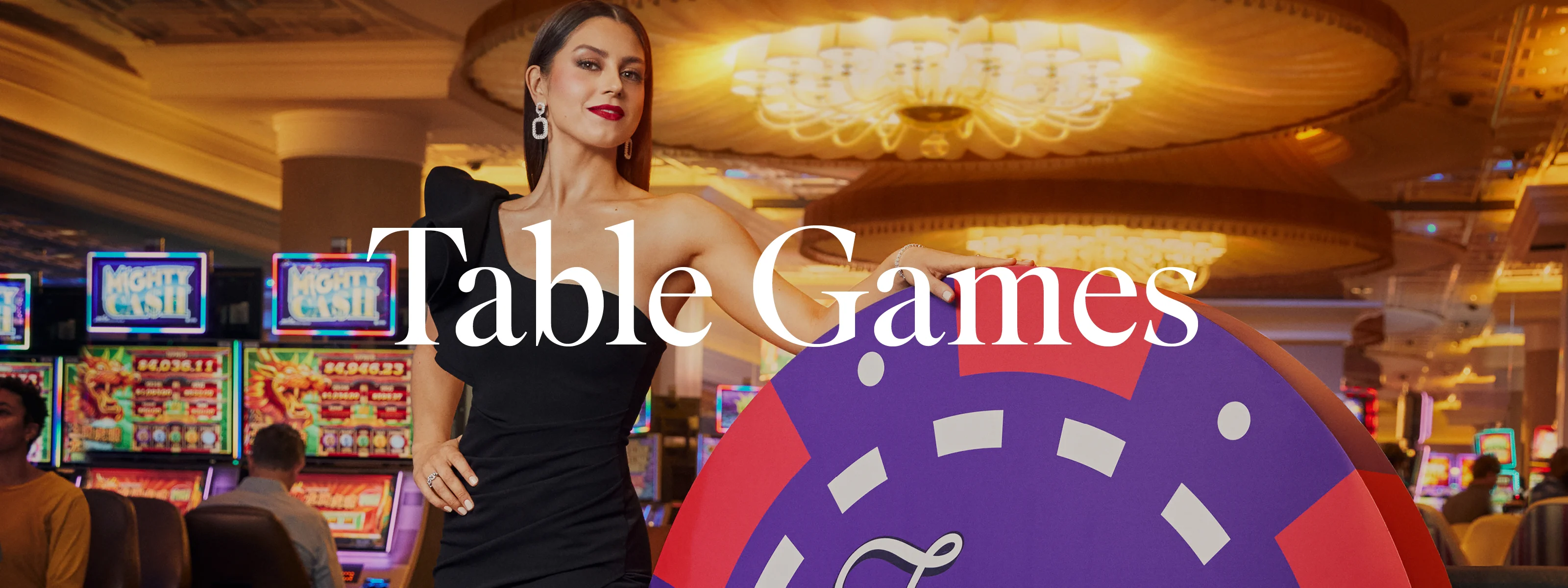 Turning Stone Casino blackjack dealer deals winning hand to woman at blackjack table 