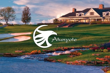 Panoramic view of Atunyote and Clubhouse with streams falling in to pond in evening sunlight