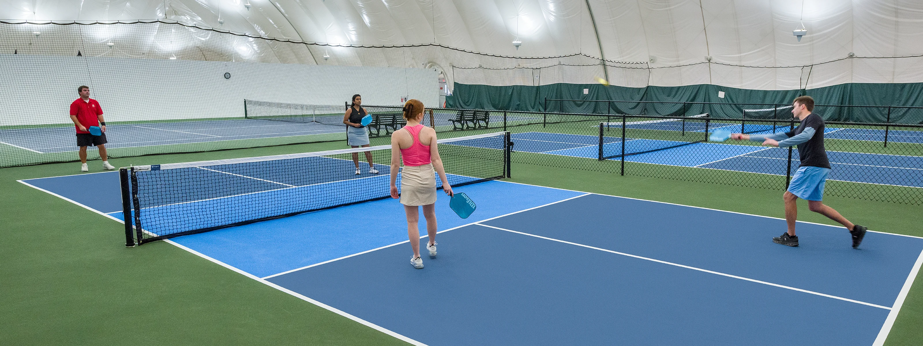 Flower lined entrance to the Sportsplex for golf, tennis, and racquetball at Turning Stone