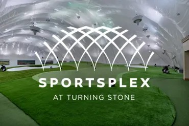 Flower lined entrance to the Sportsplex for golf, tennis, and racquetball at Turning Stone