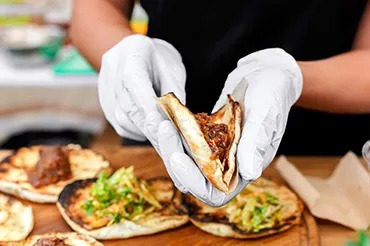 chefs cooking food over stove